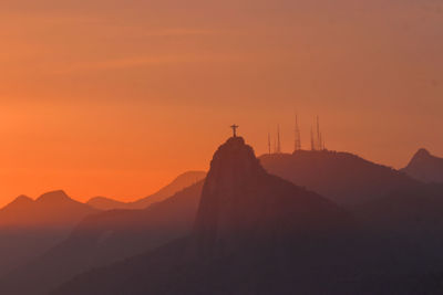 Silhouette of temple against sky during sunset