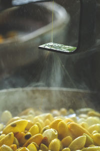 Close-up of water falling on glass