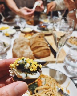 Midsection of person holding ice cream in plate