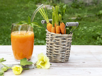 Fruits and vegetables in glass on table