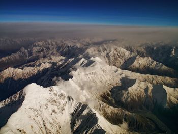 Aerial view of the himalayas against sky