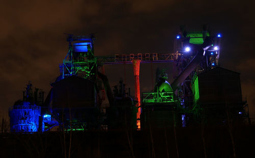 Low angle view of illuminated lighting equipment at night in landschaftsmalerei duisburg 