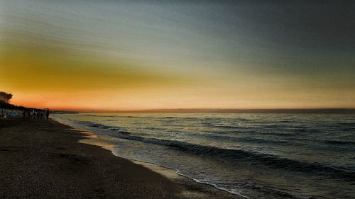 Scenic view of calm sea at sunset