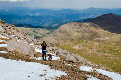 Rear view of woman looking at mountains