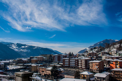 Houses in town against blue sky