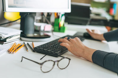 Adult woman middle aged woman working on computer in bright modern office