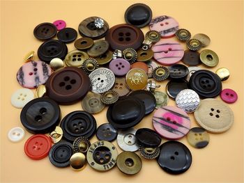 High angle view of various buttons on table