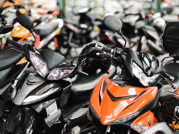Close-up of parked motorcycles in the city