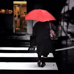 Full length of woman walking on road