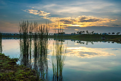 Scenic view of lake against sky during sunset