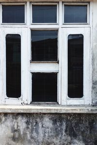 Weathered window of a forsaken house in myanmar