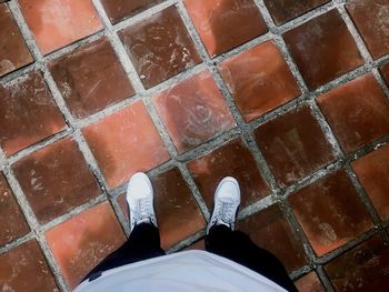 Low section of man standing on floor