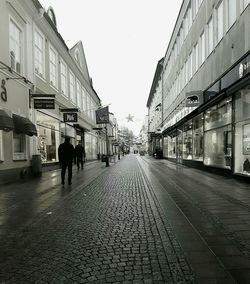 Man walking on street in city