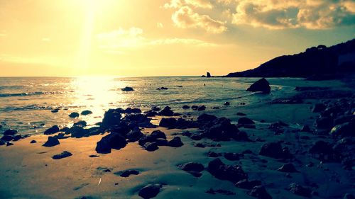 Scenic view of sea against sky at sunset