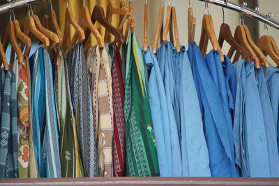 Clothes hanging on rack in store for sale