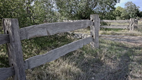 Wooden fence on field