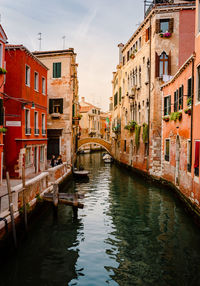 Typical venice canal with tourists and colorful houses