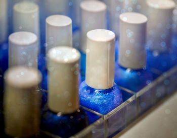 Close-up of bottles of blue nail polish 