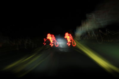 Close-up of illuminated light trails in the dark