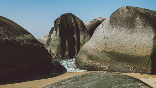 Panoramic view of rocks against clear sky