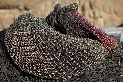 Close-up of fishing nets on sunny day