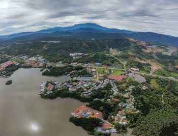 High angle view of buildings and mountains against sky