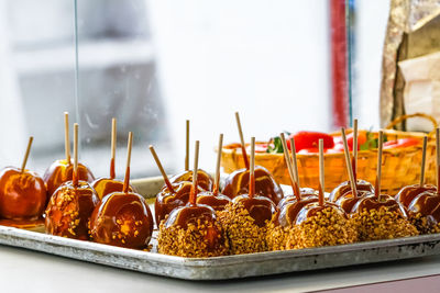 Chocolate cake popes garnished with crushed nuts kept in serving tray