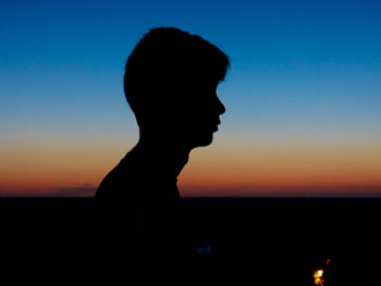 Silhouette of man against sunset