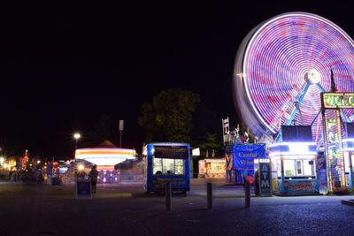 Ferris wheel against sky at night