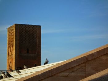 Low angle view of built structure against blue sky