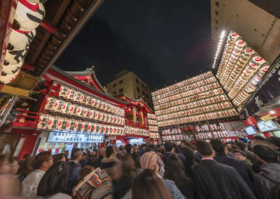 People at illuminated temple