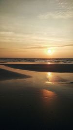 View of beach at sunset