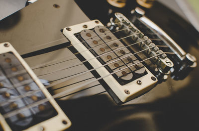 Close-up of black guitar