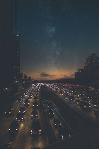 Cars moving on road in city at night