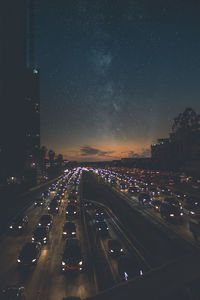 Aerial view of illuminated city at night