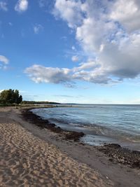 Scenic view of beach against sky