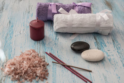 High angle view of spa treatment items on wooden table