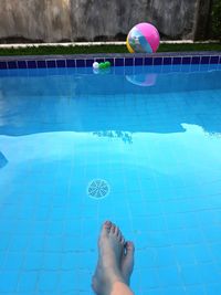 Low section of person in swimming pool