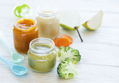 Baby food, assortment of fruit and vegetable puree, flat lay, top view, space for text