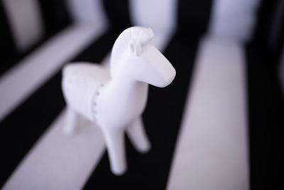 Close-up of white sculpture on table