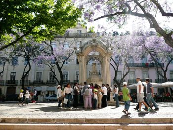 Statue of people in city