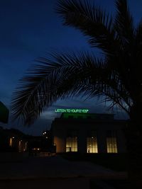 Low angle view of illuminated building against sky at night