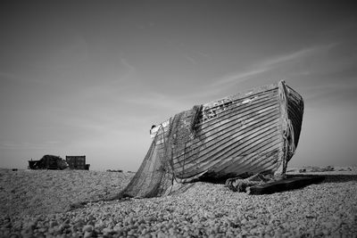 Lifeguard hut on beach against sky