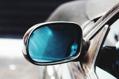 Close-up of car side-view mirror