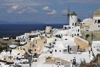 High angle shot of town against calm blue sea