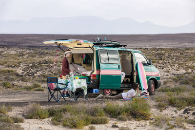 Friends by motor home on land