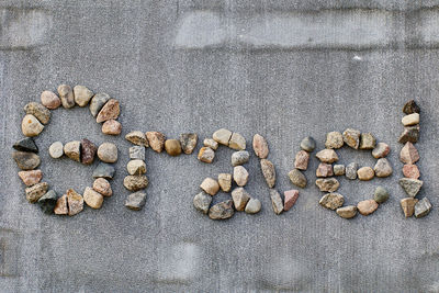 High angle view of pebbles on sand