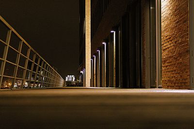 Illuminated tunnel at night