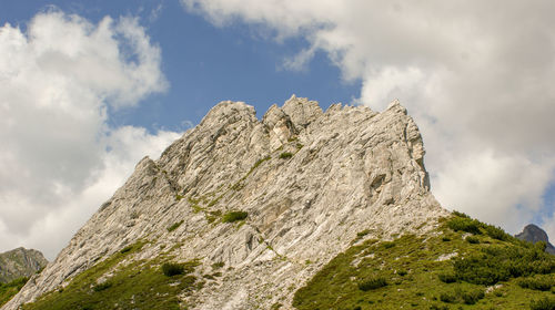 Low angle view of rock formation against sky