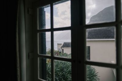 Sea seen through window of house